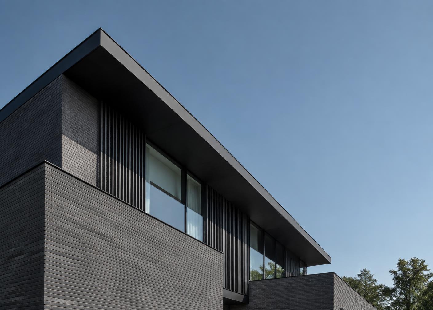 Modern home architecture with a strong roofline.
